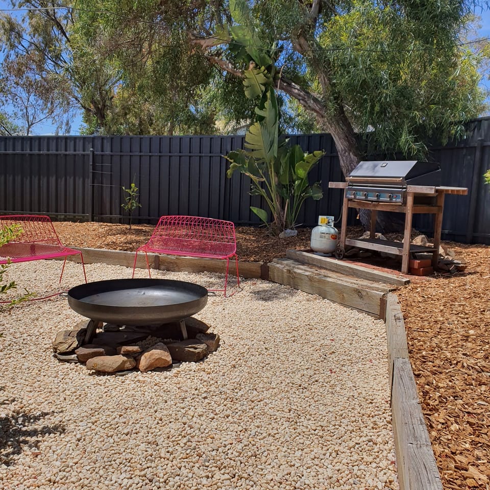 fire pit BBQ area with high fences all around the property 