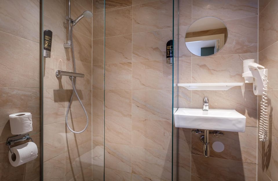 Shower, free toiletries, hair dryer, towels