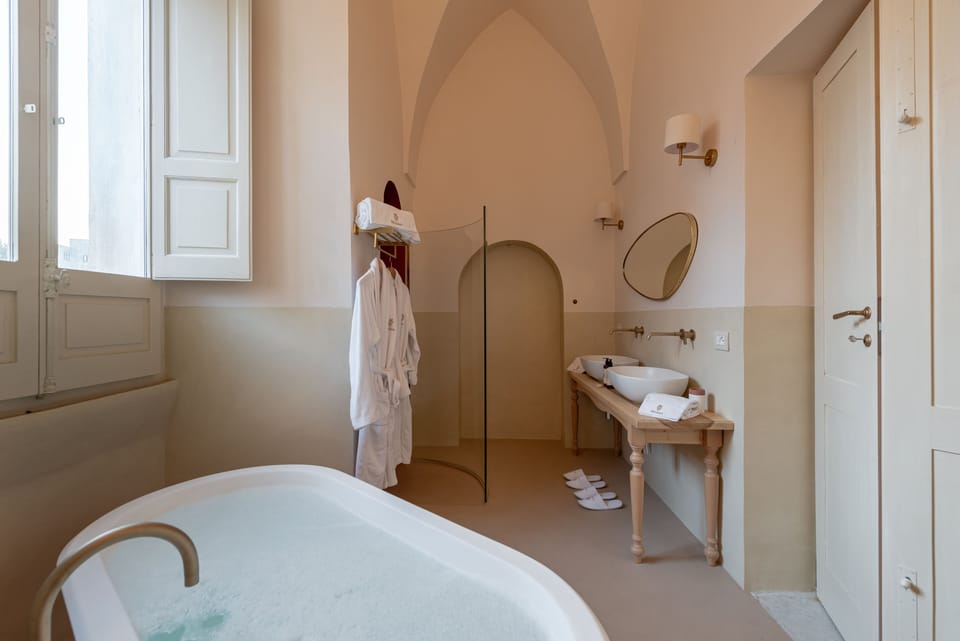 Family Suite, Garden View | Bathroom | Separate tub and shower, free toiletries, hair dryer, bathrobes