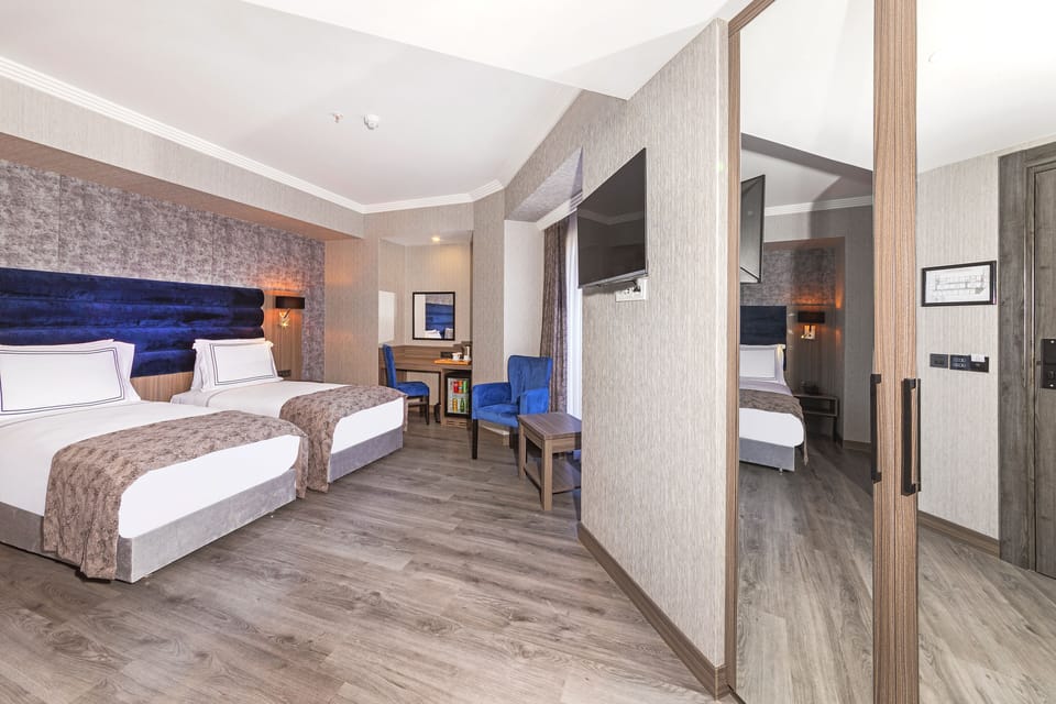 Standard Double or Twin Room | Minibar, in-room safe, desk, laptop workspace