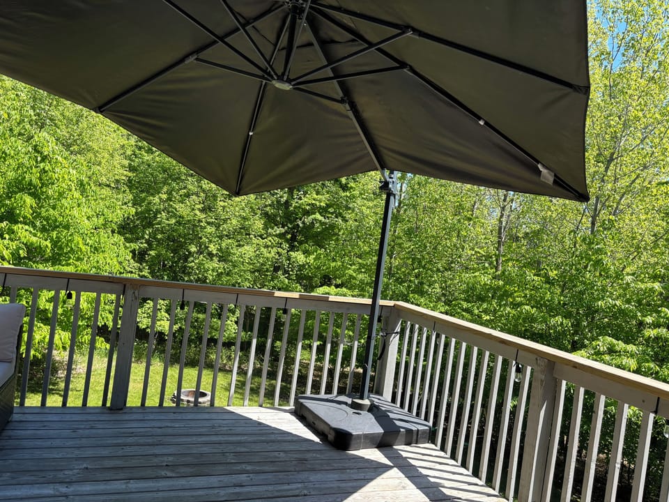 Outdoor balcony with oversized umbrella