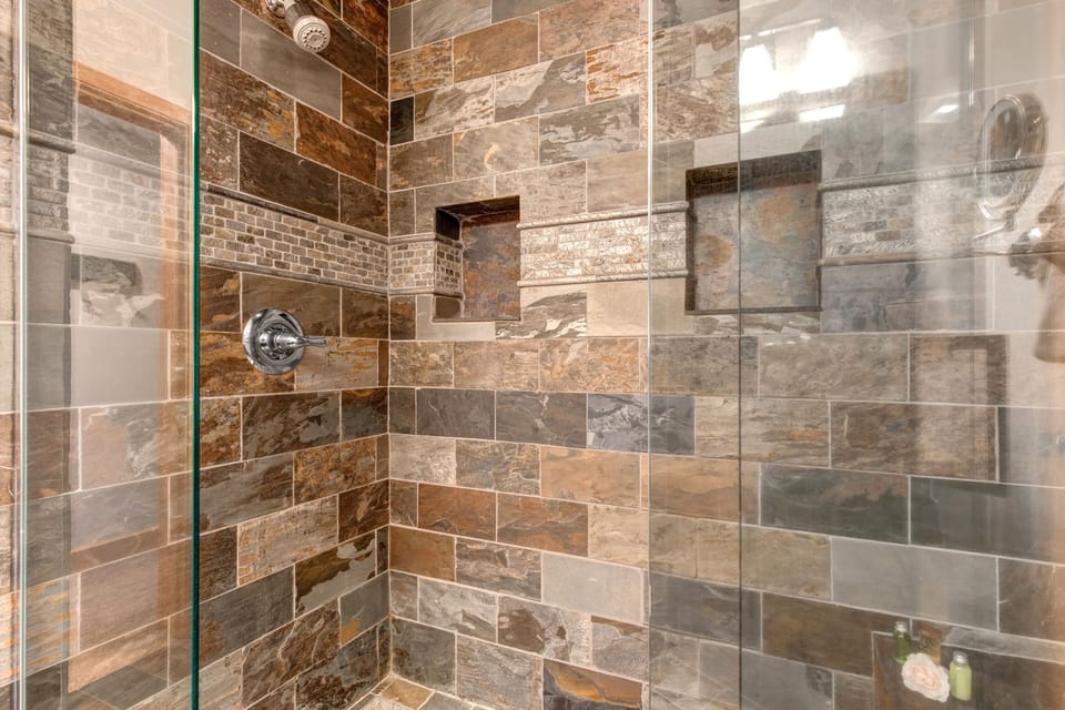 Master Bathroom with double sinks and stone & glass shower