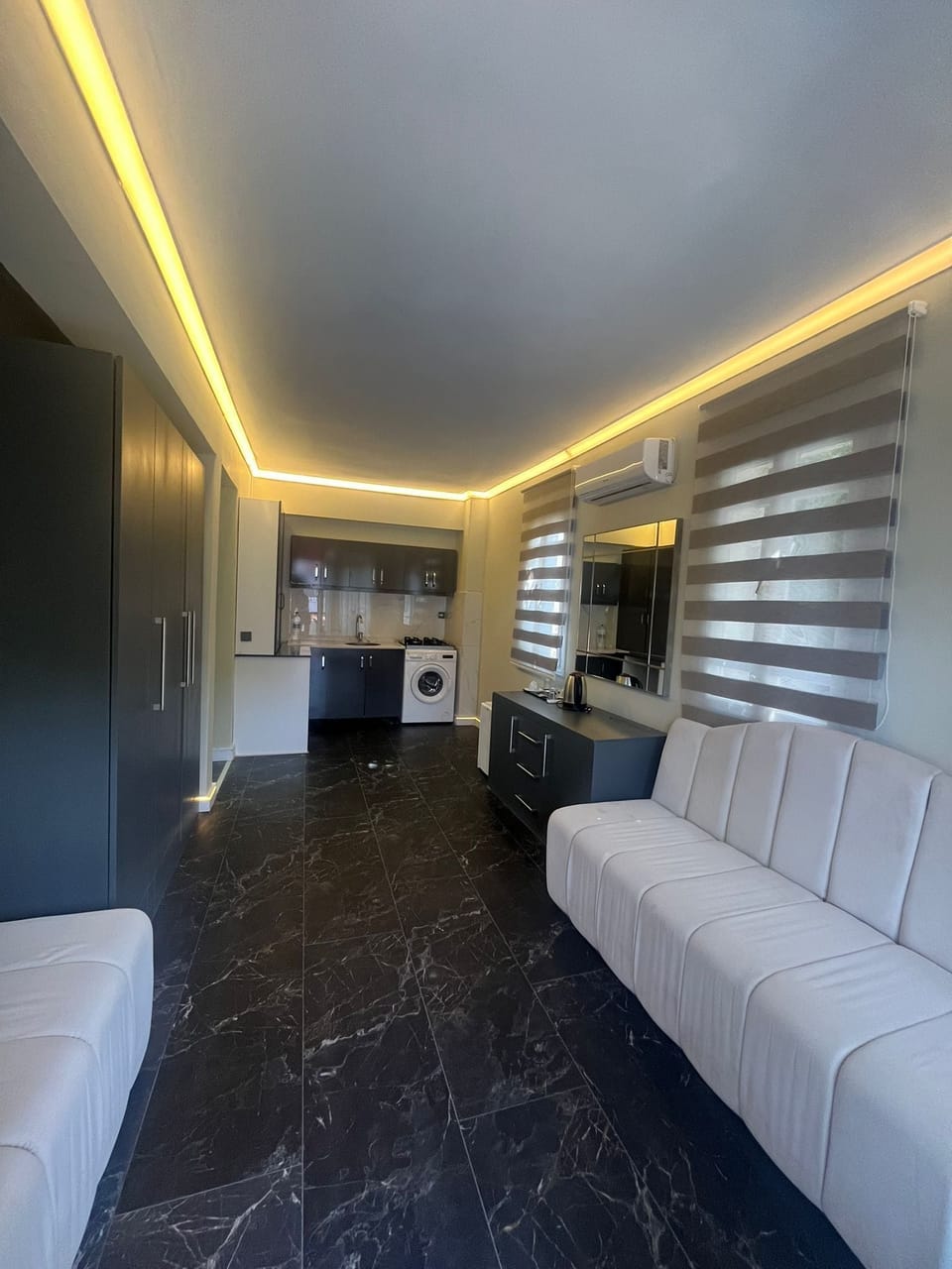 Family Suite, 1 Bedroom | Living area | 32-inch TV with satellite channels