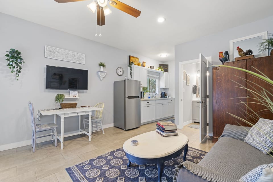 Kitchen table/work area, large smart TV swivels to watch from wherever you sit.