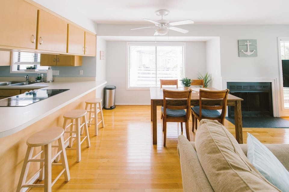 Dining room area with breakfast bar seating. 