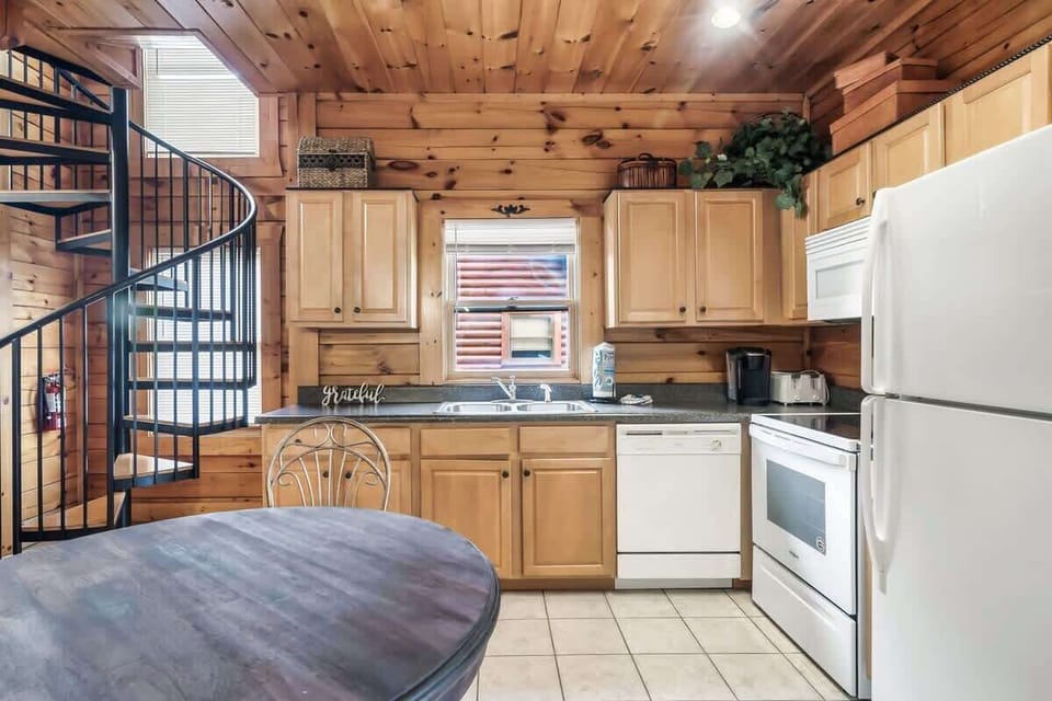 The kitchen has plenty of space for you to keep snacks or to prepare a home-cooked meal!