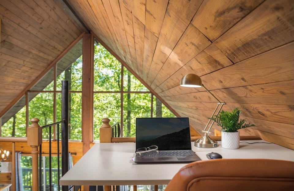 Catch up on your emails from the loft desk that features a relaxing view