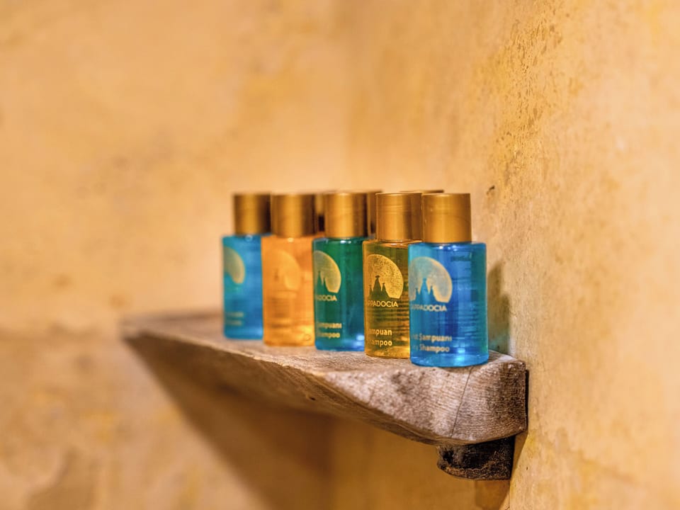 Deluxe Family Suite | Bathroom | Shower, rainfall showerhead, hair dryer, towels