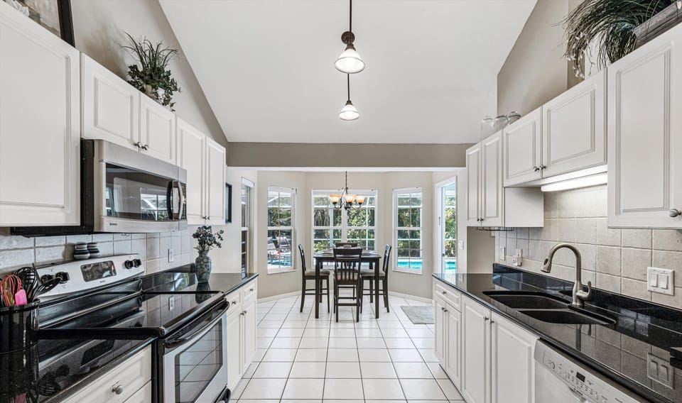 The galley kitchen is well equipped & has a breakfast nook with room for 4