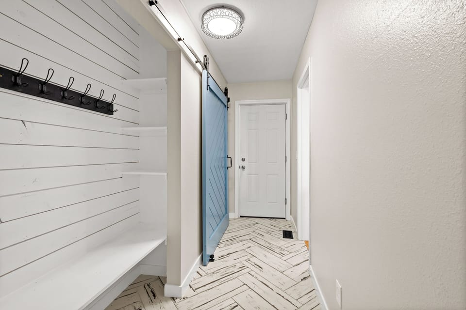Main level hallway to garage and bunk room.