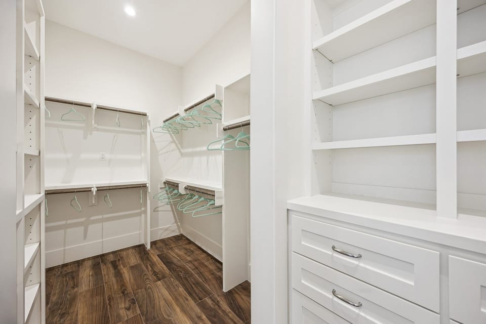Walk-in closet located off the primary bathroom