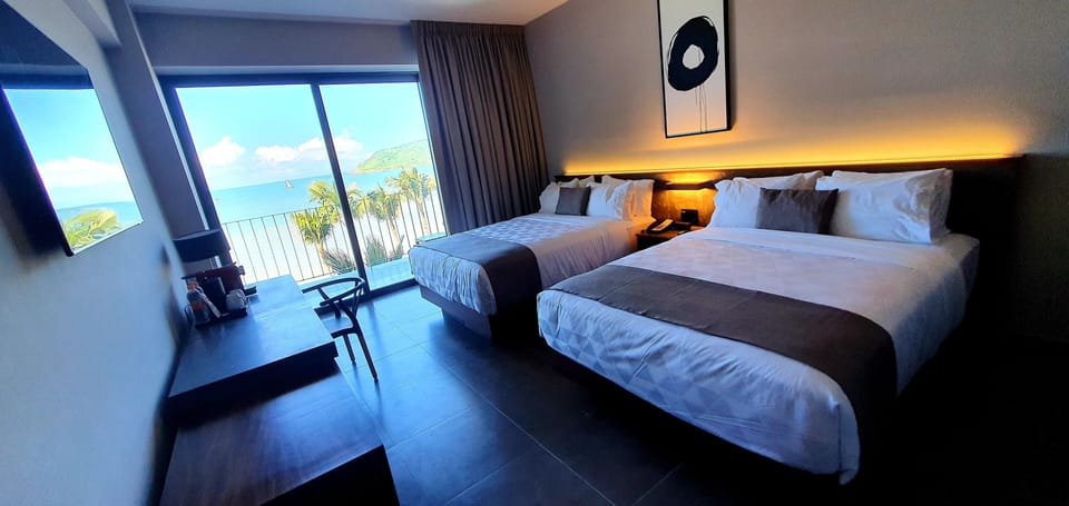 Deluxe Double Room, 2 Double Beds, Ocean View | In-room safe, desk, laptop workspace, blackout drapes