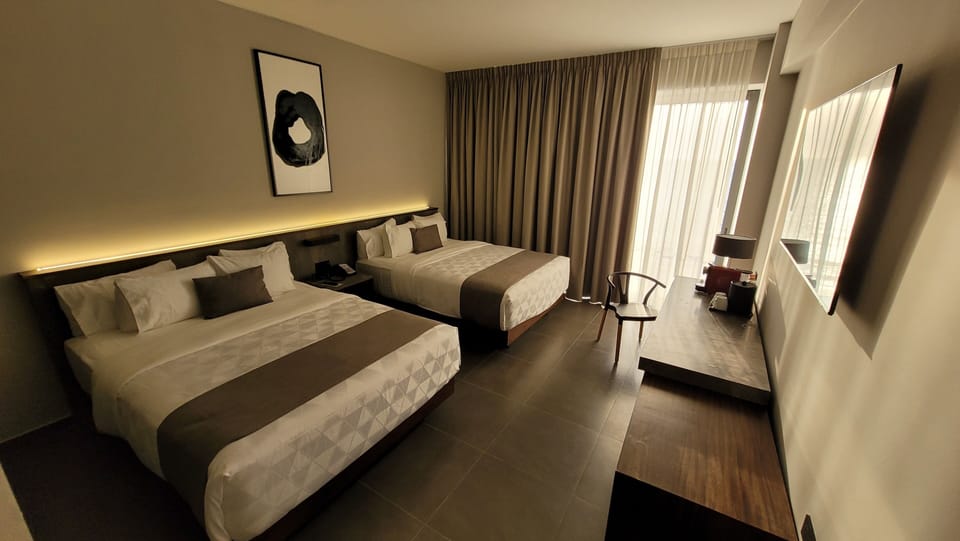 Deluxe Double Room, 2 Double Beds, City View | In-room safe, desk, laptop workspace, blackout drapes