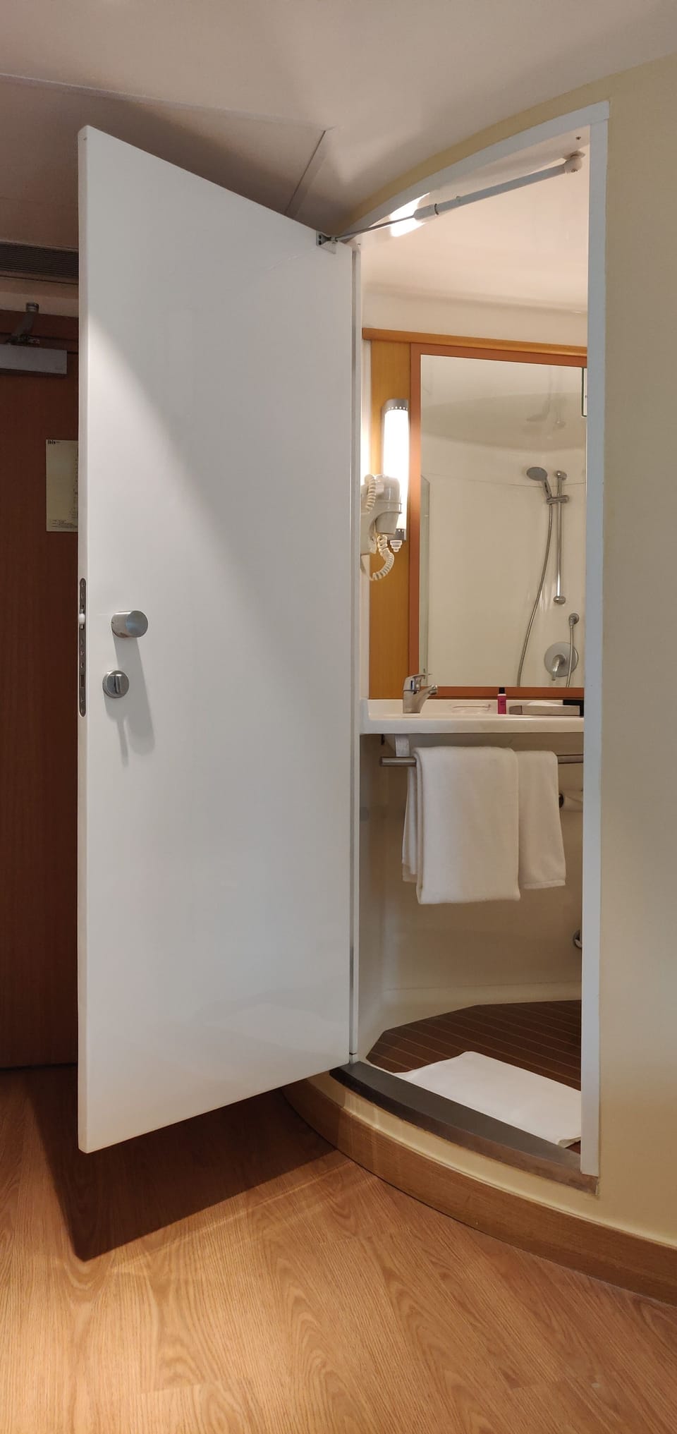 Shower, rainfall showerhead, designer toiletries, hair dryer