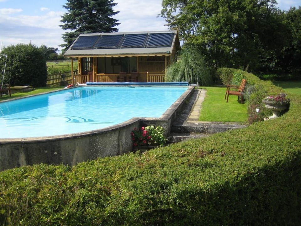 outdoor heated swimming pool open may-sept located at the north end of the farm