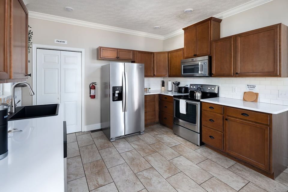 Another angle showcasing kitchen layout & easy access to backyard door