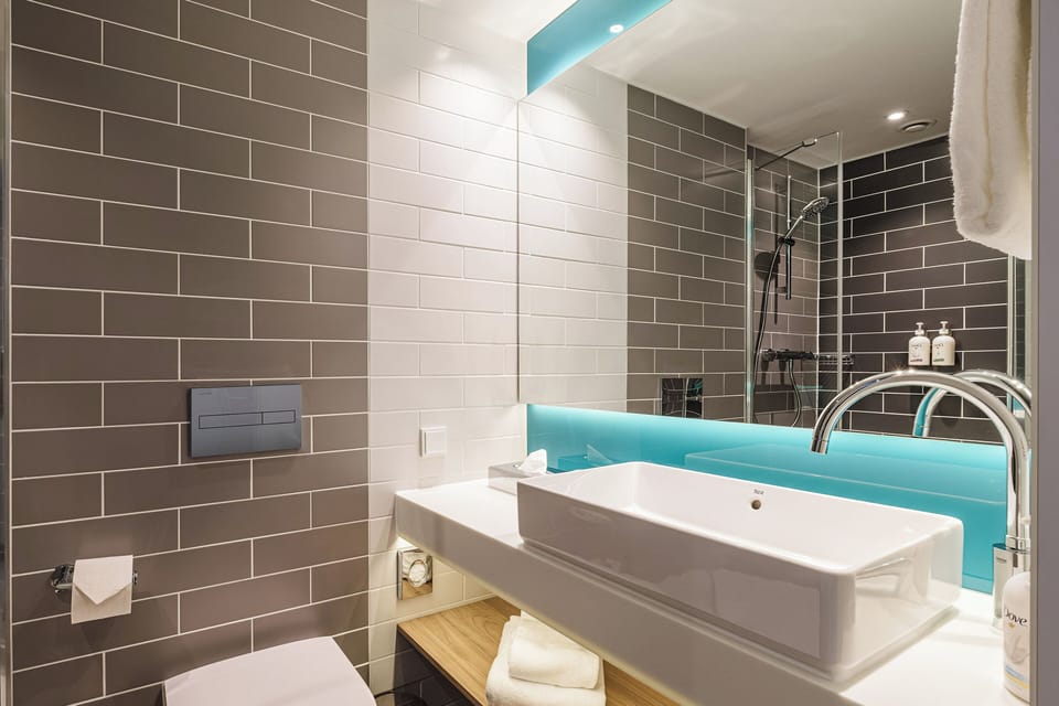 Shower, eco-friendly toiletries, hair dryer, towels