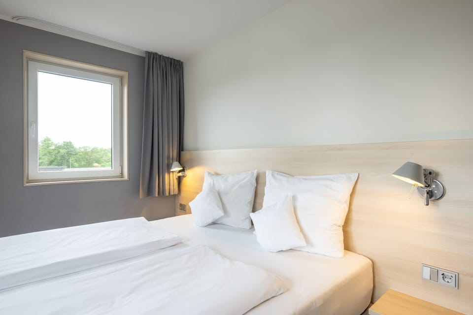 Premium bedding, pillowtop beds, desk, blackout drapes