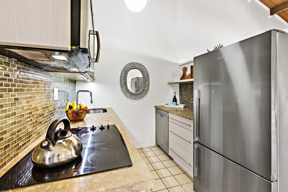 Beautifully remodeled ktichen featuring Stainless steel appliances and a beautiful tile backsplash