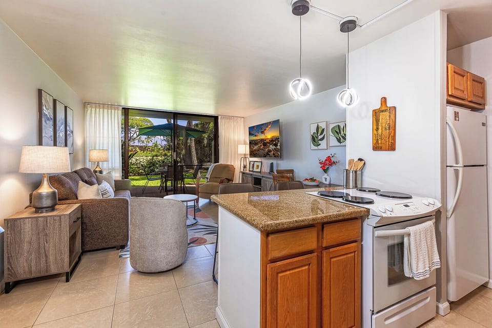 Step into your bright, open-concept retreat where the kitchen flows effortlessly into the living area.