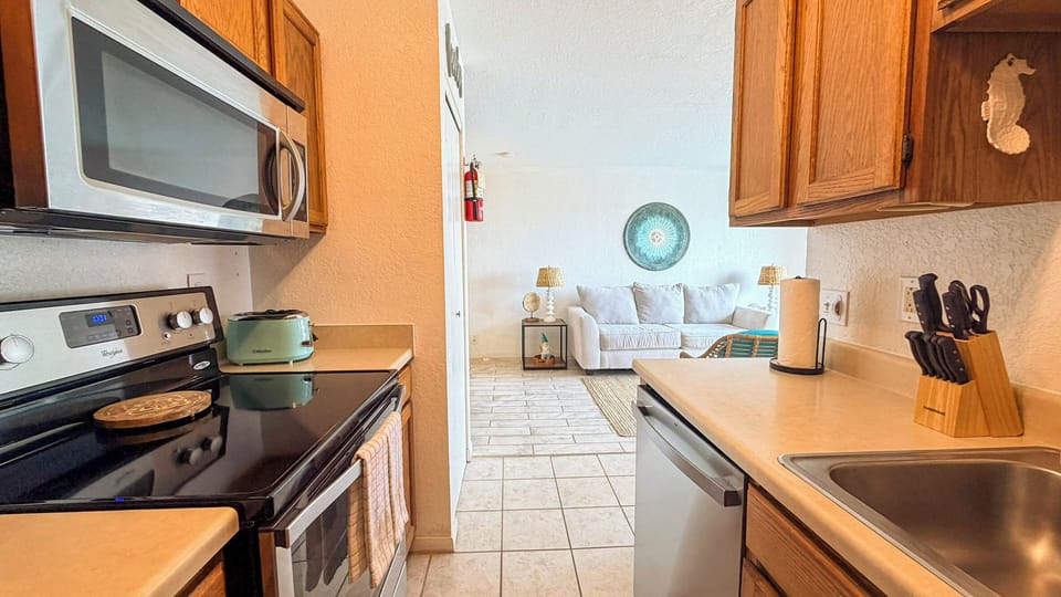 Your fully equipped kitchen opens to a bright living space, perfect for preparing meals while staying connected with loved ones.