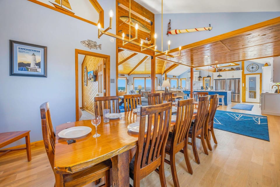 Gather around this spacious dining table where your group can share memorable meals together in this beautifully appointed open-plan space.