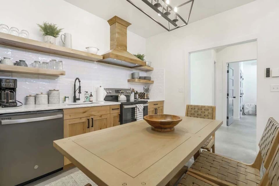 Create culinary magic in this contemporary kitchen featuring top-of-the-line appliances.