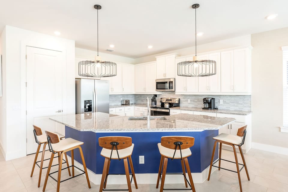 Cook a savory dinner for the family in the fully equipped kitchen with stainless steel appliances and granite countertops