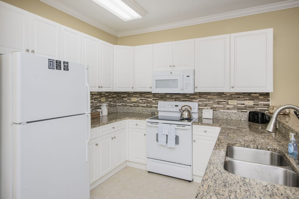 Full kitchen with pots, pans, cutlery, etc. 
