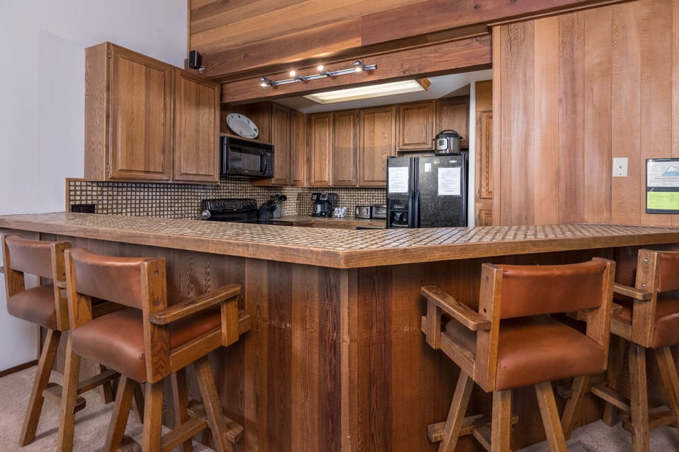 Open kitchen with bar seating up to 4 people