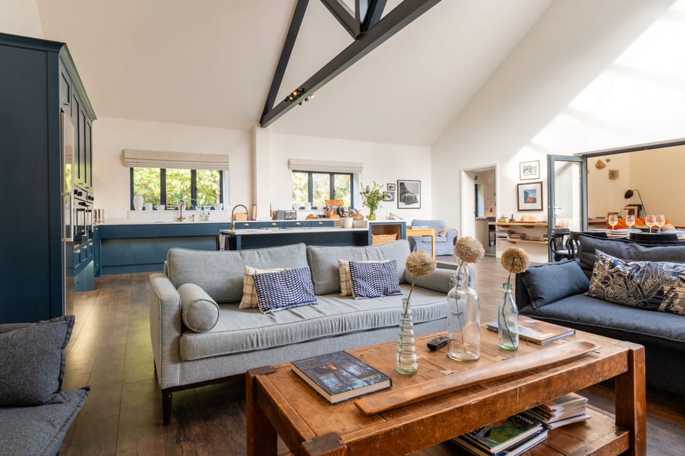 Open-plan sitting, kitchen and dining area with relaxed and comfortable seating