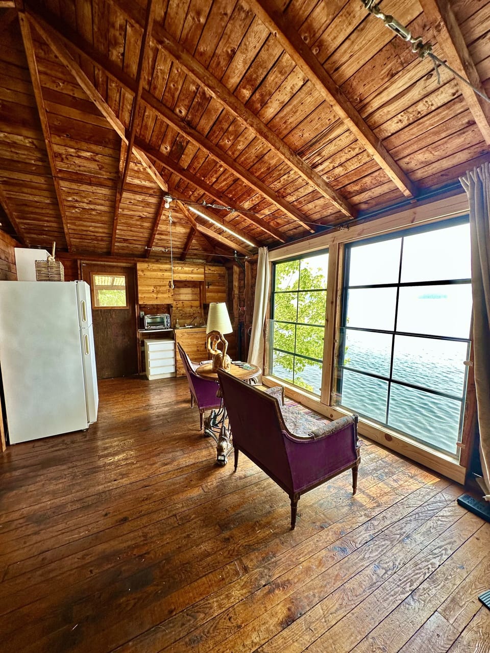 Guest cabin - lake view from seating area - floor to ceiling collapsible windows