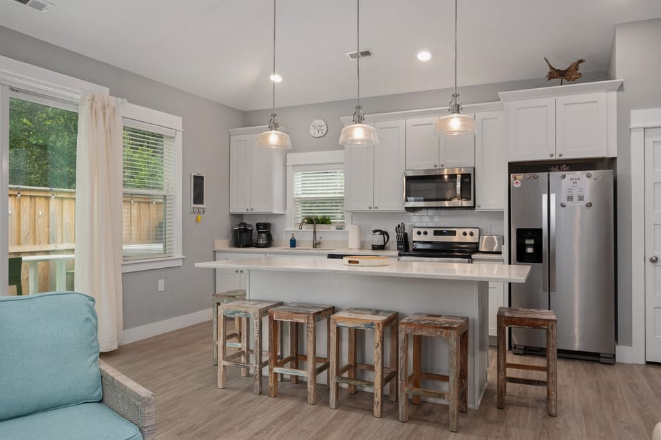 Beautiful stone countertops, soft close cabinets and stainless steel appliances. Quick access to the backyard and hot tub!