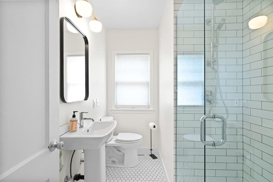 Refresh and recharge in this stylish bathroom featuring a sleek walk-in shower and contemporary design.