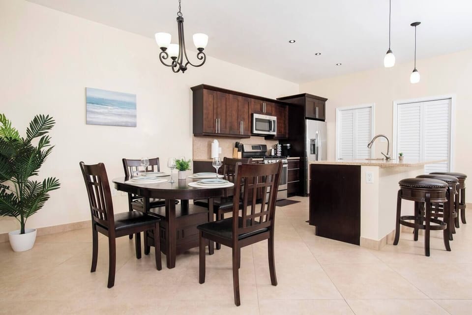 The dining room is a wonderful space to eat meals prepared in the fully functional, spacious kitchen that features stainless steel appliances. 