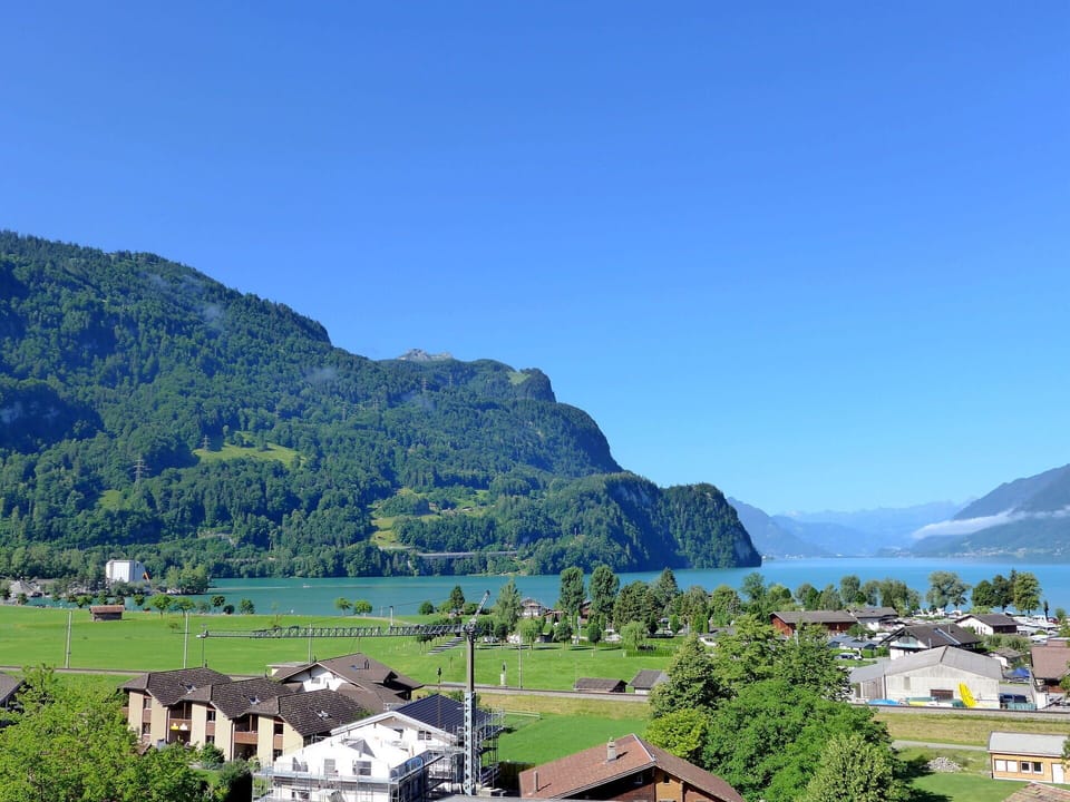Sky, Water, Mountain, Plant, Natural Landscape, House, Highland, Lake, Coastal And Oceanic Landforms, Tree