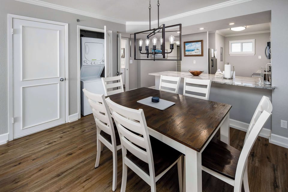 Dining table with seating for six and washer and dryer