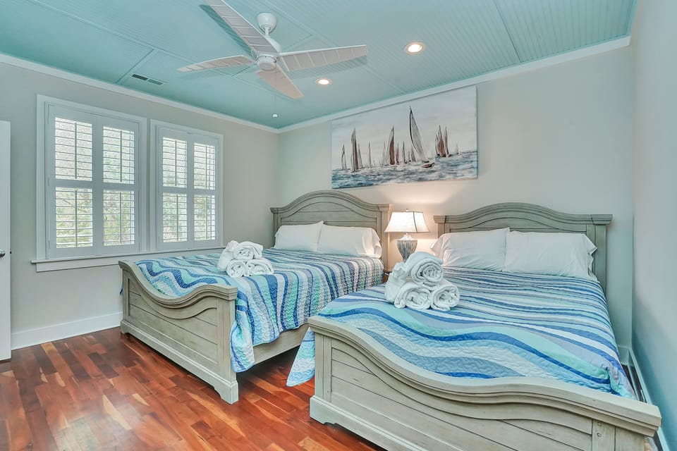 Drift off to sleep in your coastal-themed bedroom, where ocean-blue bedding and nautical artwork create a soothing seaside retreat.