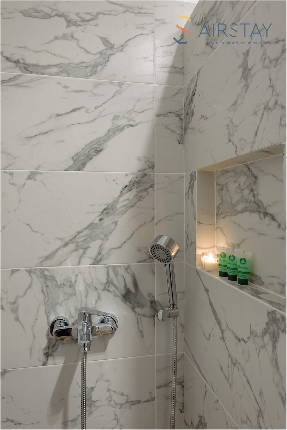 Shower, rainfall showerhead, hair dryer, towels