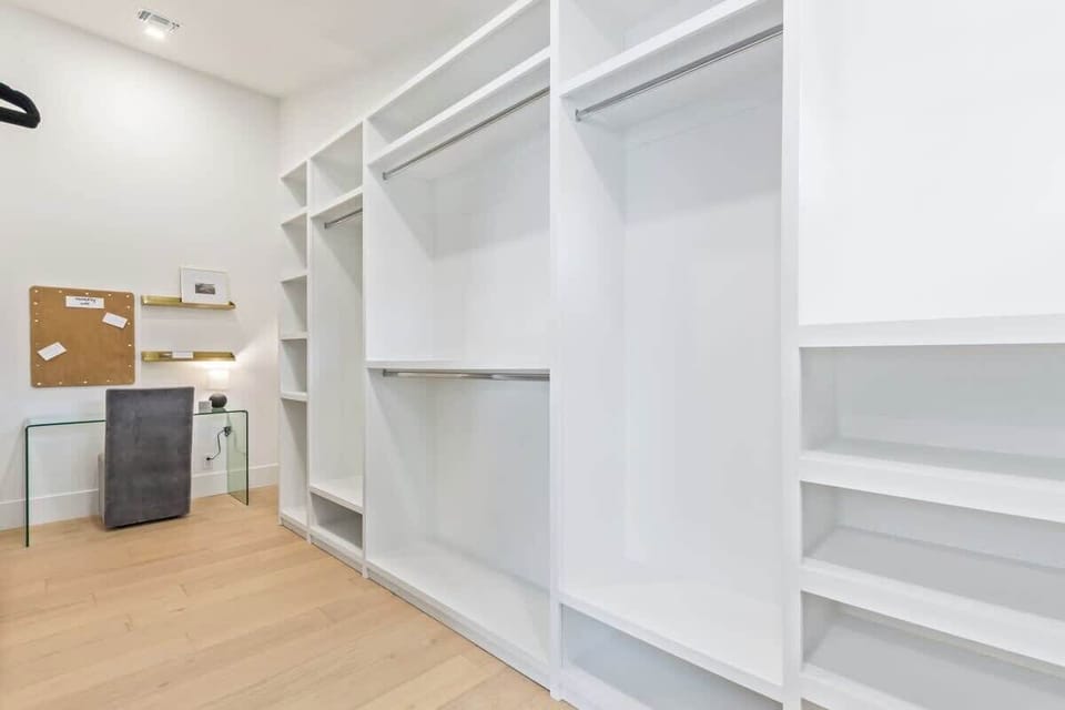 Large walk-in closet with private desk/workspace