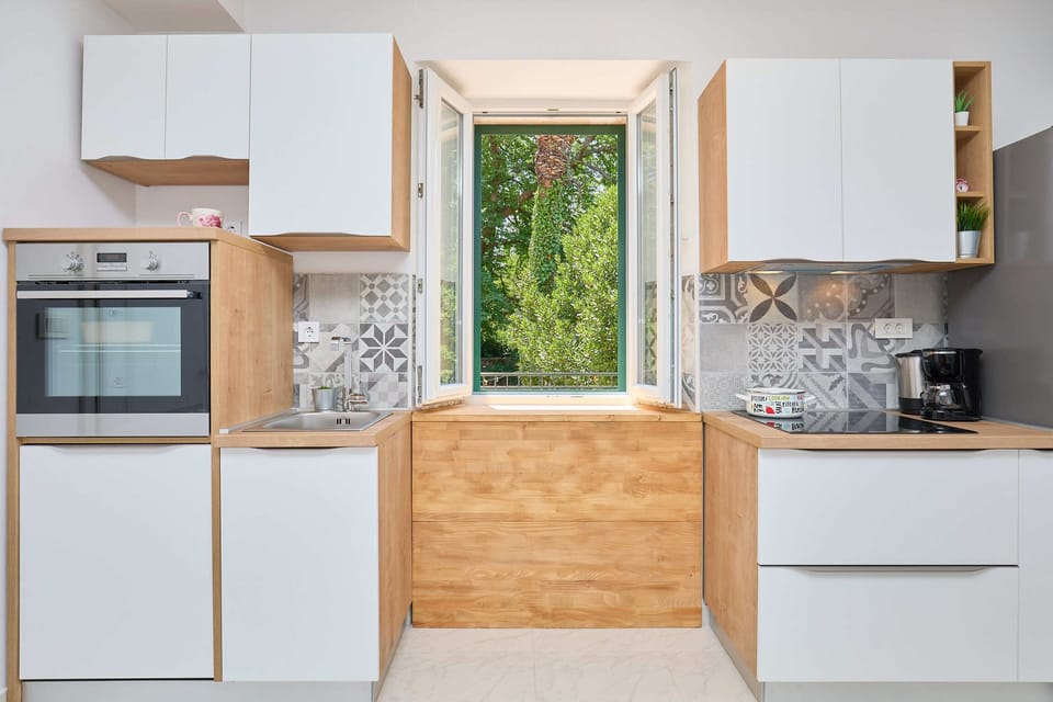 Apartment (1 Bedroom) | Private kitchen | Fridge, oven, stovetop, dishwasher