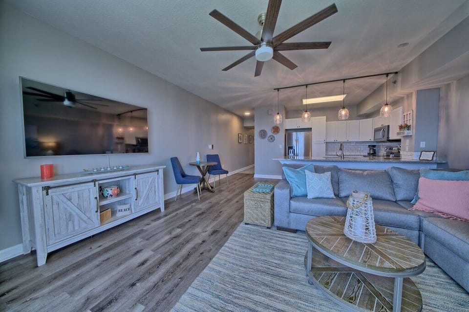 Our family loves movie night, so we designed this cozy living space to fit everyone comfortably. With a large sectional and plenty of room to stretch out, it's the perfect spot to unwind and watch a movie together after a fun day in the sun.