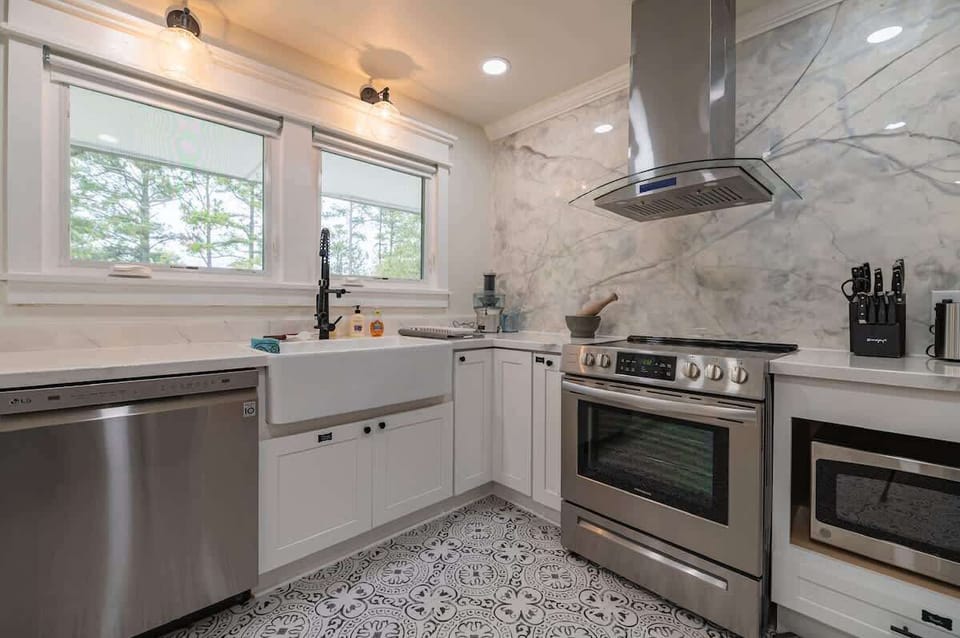 Kitchen is thoughtfully stocked with spices, cookware, and all the essentials you may need to feel right at home while preparing your favorite meals.