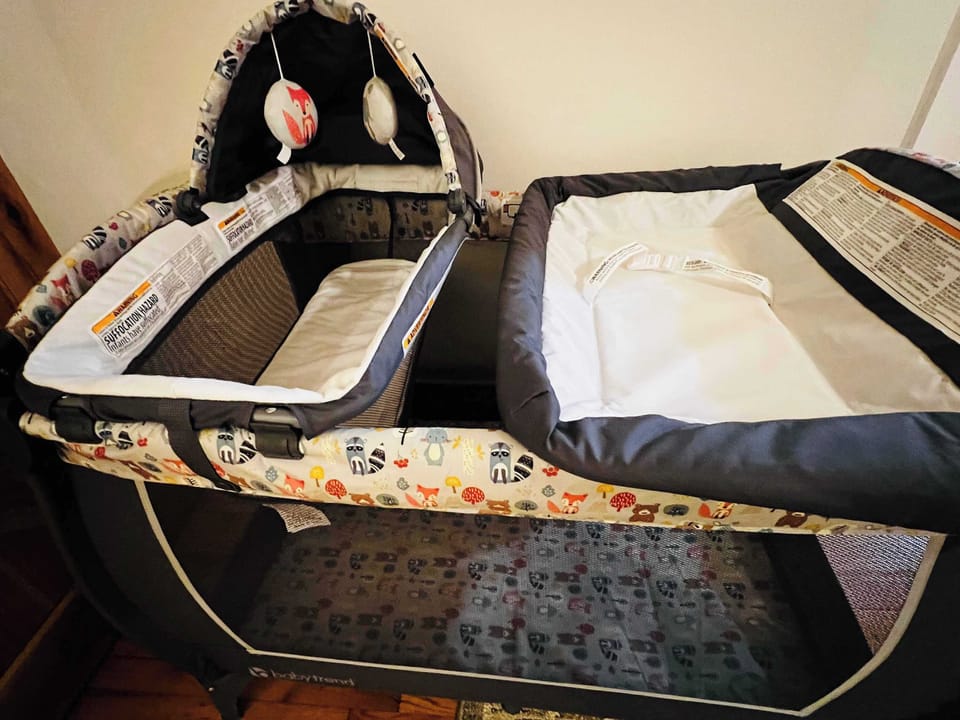 Pack and play, close up, in largest master king suite. 