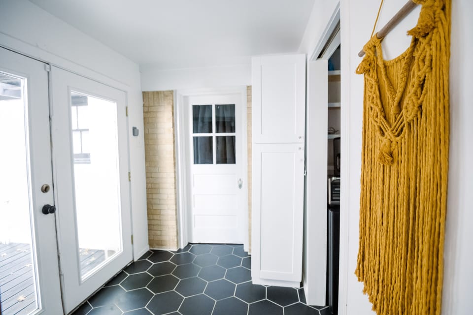 Entrance to this foyer where you'll access private laundry room, bed, and bath.