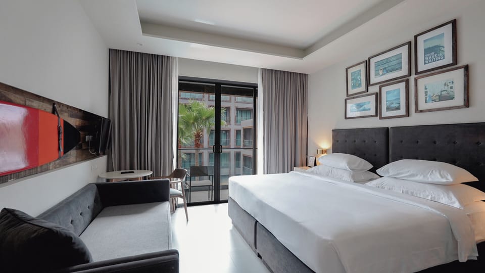 Deluxe Room, Pool View | In-room safe, desk, blackout drapes, iron/ironing board