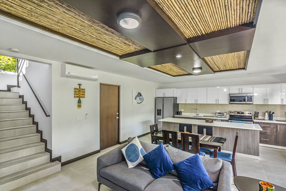 Take a right to the patio and a left up the stairs to three of the bedrooms. 