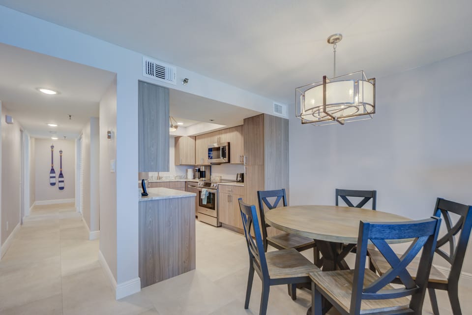 View of the dining table and the kitchen.
