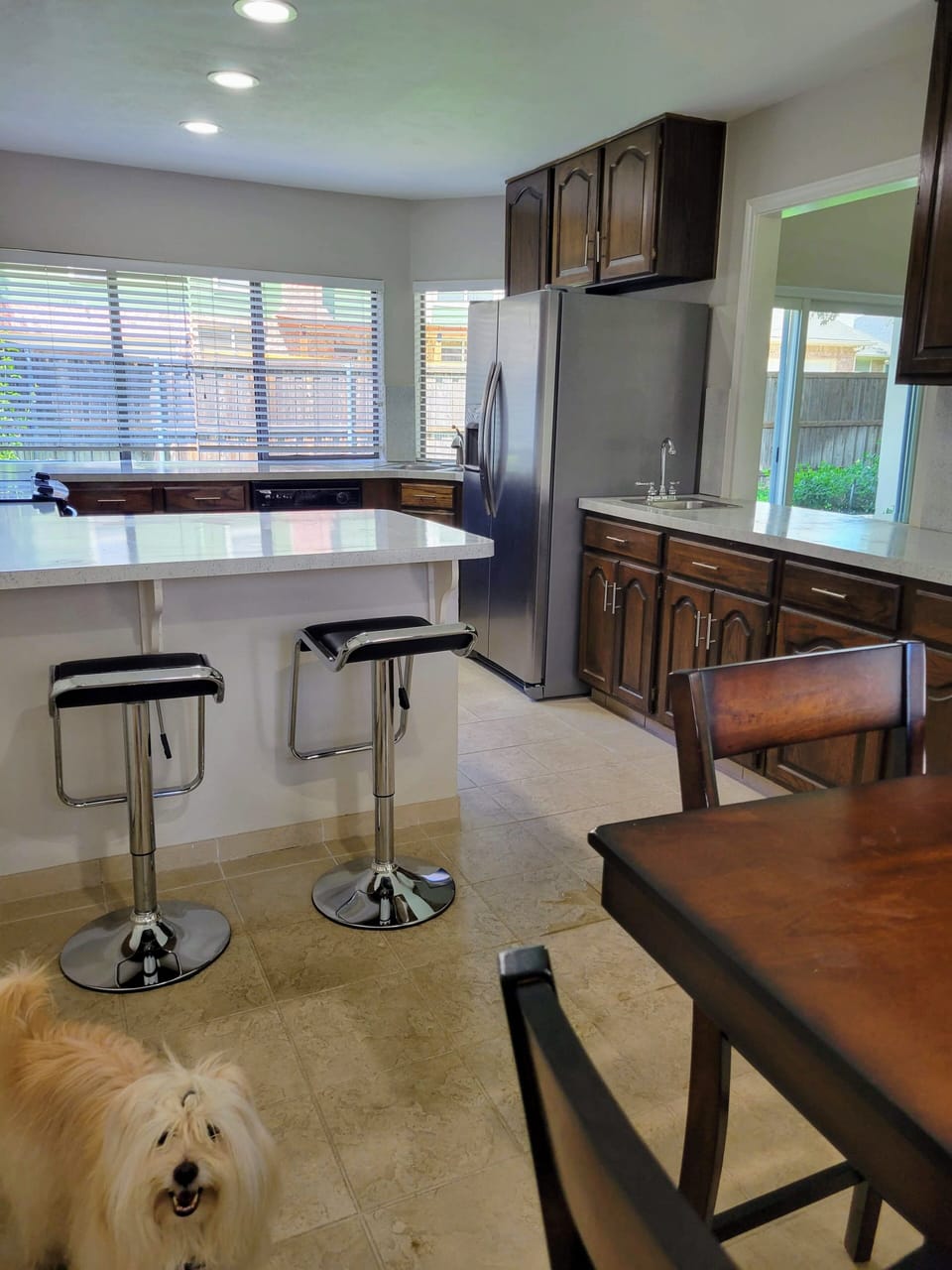 Spacious kitchen with breakfast table and double bar table.