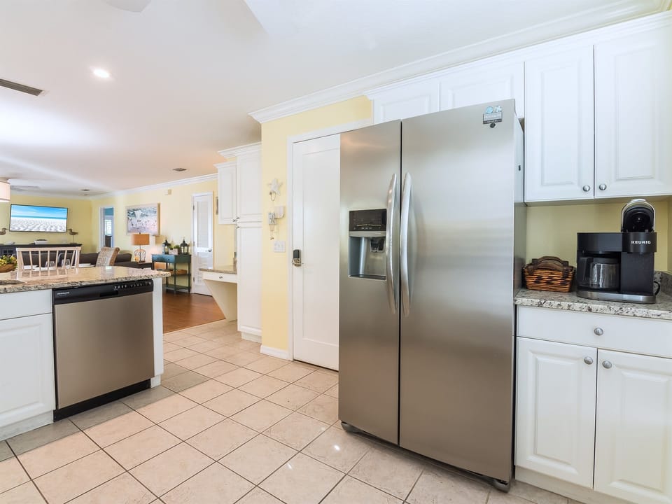 Fully stocked kitchen with stainless steel appliances